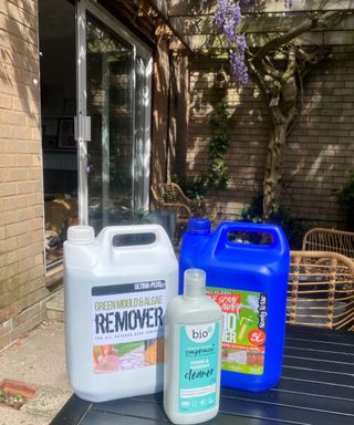 3 types of patio cleaners in bottles on Annie's black table