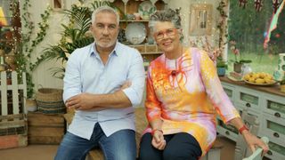 Paul Hollywood in a blue shirt and Dame Prue Leith in a colourful top in the tent for The Great Celebrity Bake Off for Stand Up to Cancer