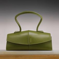 Green SSENSE bag with faded dark background