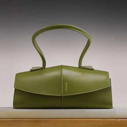 Green SSENSE bag with faded dark background
