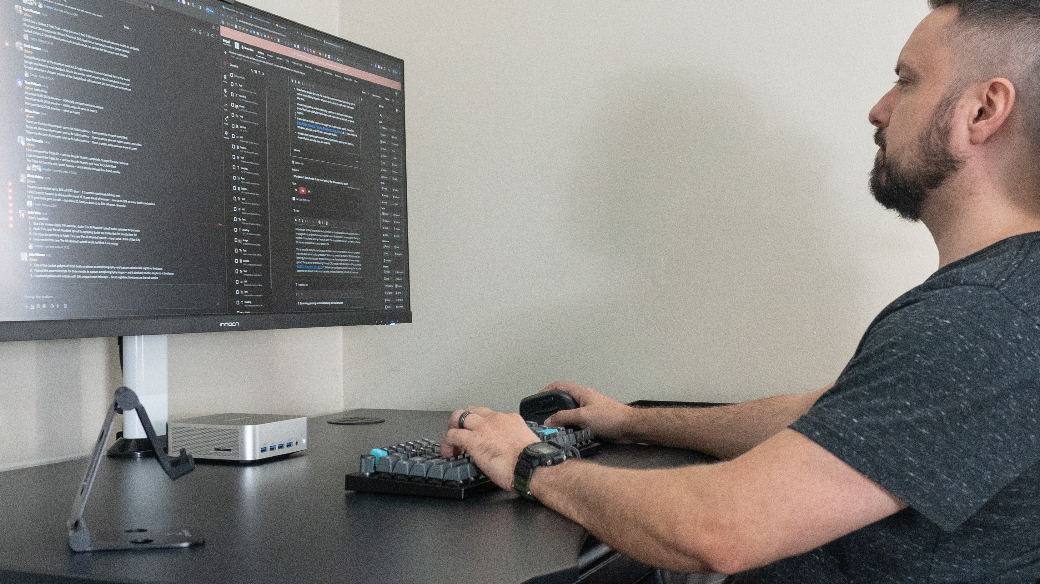 A person working on the Geekom A9 Max 2026 Edition with multiple browser windows open