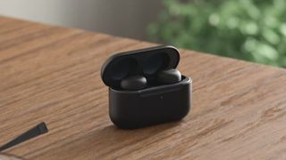 Amazon Echo Buds on wood counter