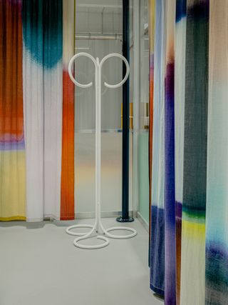 Coat rack and colourful curtain