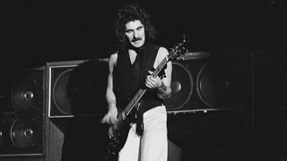 Bassist Geezer Butler of Black Sabbath performs on stage at Hammersmith Odeon, London, January 1976