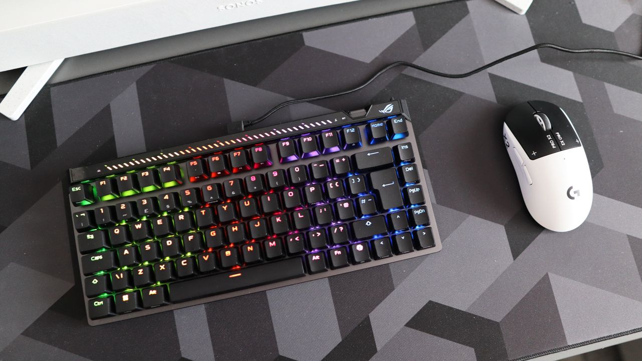 The Asus ROG Falchion Ace 75 HE on a desk with the lighting enabled.