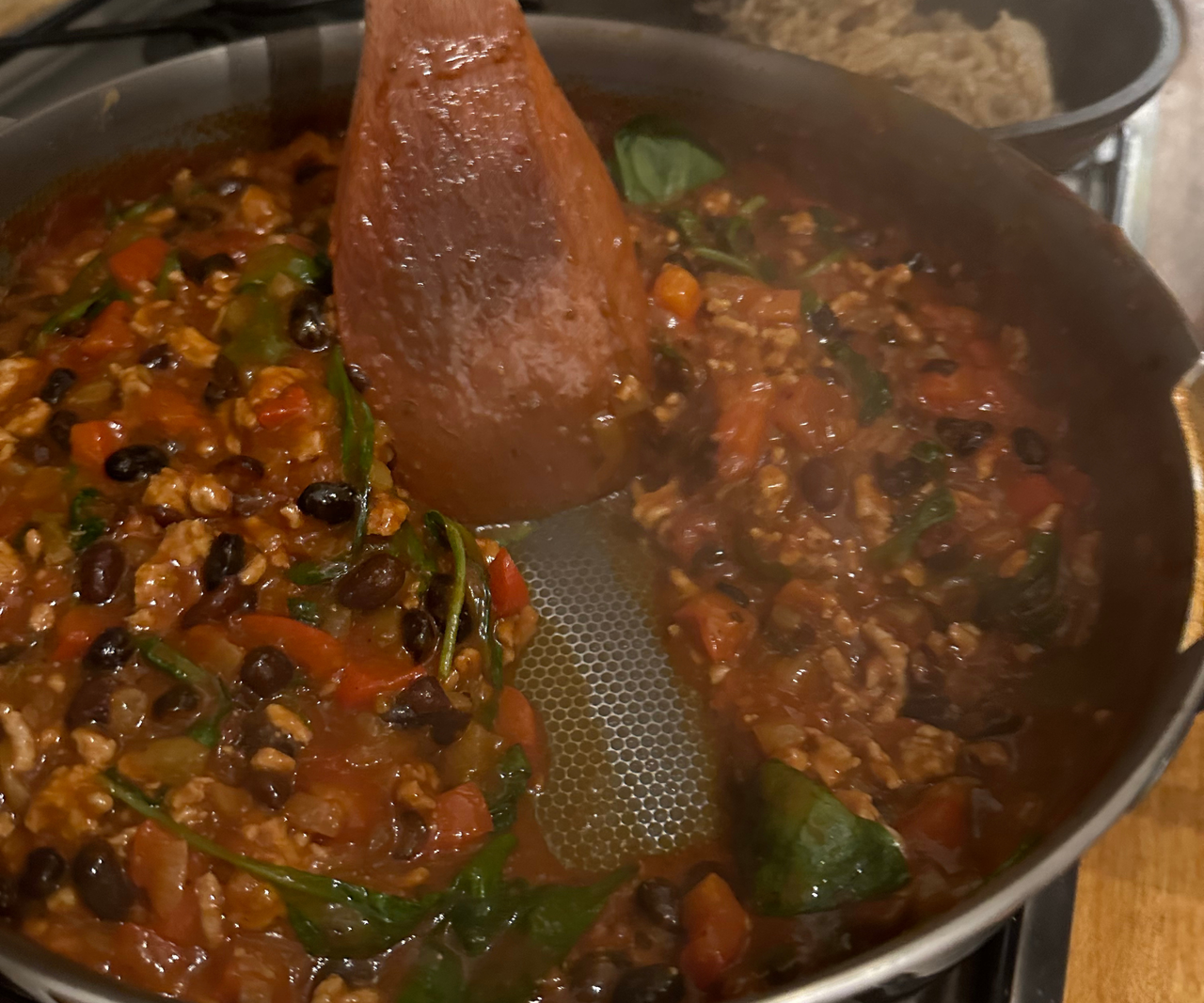Our Place Titanium Always Pan Pro sizzling chilli in the kitchen