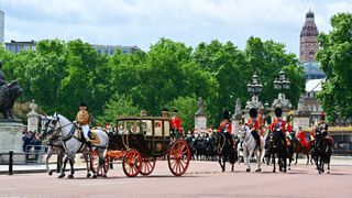 Queen Elizabeth II leaves Buckingham Palace in a carriage during Trooping The Colour, the Queen's annual birthday parade