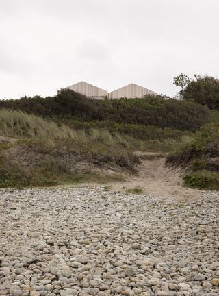 Heatherhill Beach house by Norm Architects seen over the dunes