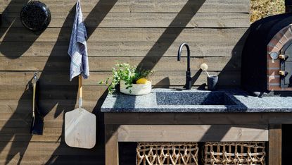 outdoor sink ideas: stone sink in outdoor kitchen