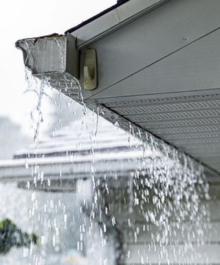 Rain pouring off gutter