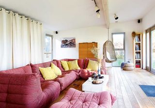 garden studio room interior living area with red sofa