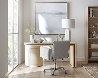 Light home office with gray chair