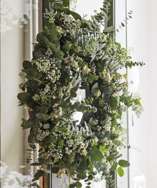 Winter wreath with foliage and white berries