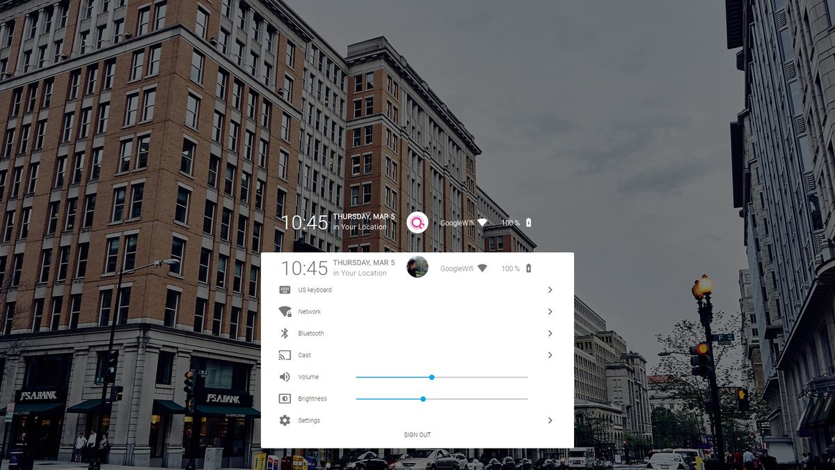 The center logo icon triggers a settings drawer when clicked, with many of the settings toggles seen on Chrome OS.