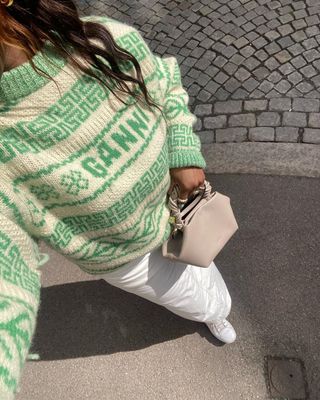 12 Scandi Out Ideas: Nnenna styles a colourful knit jumper with a cargo maxi skirt and Stan Smith sneakers.