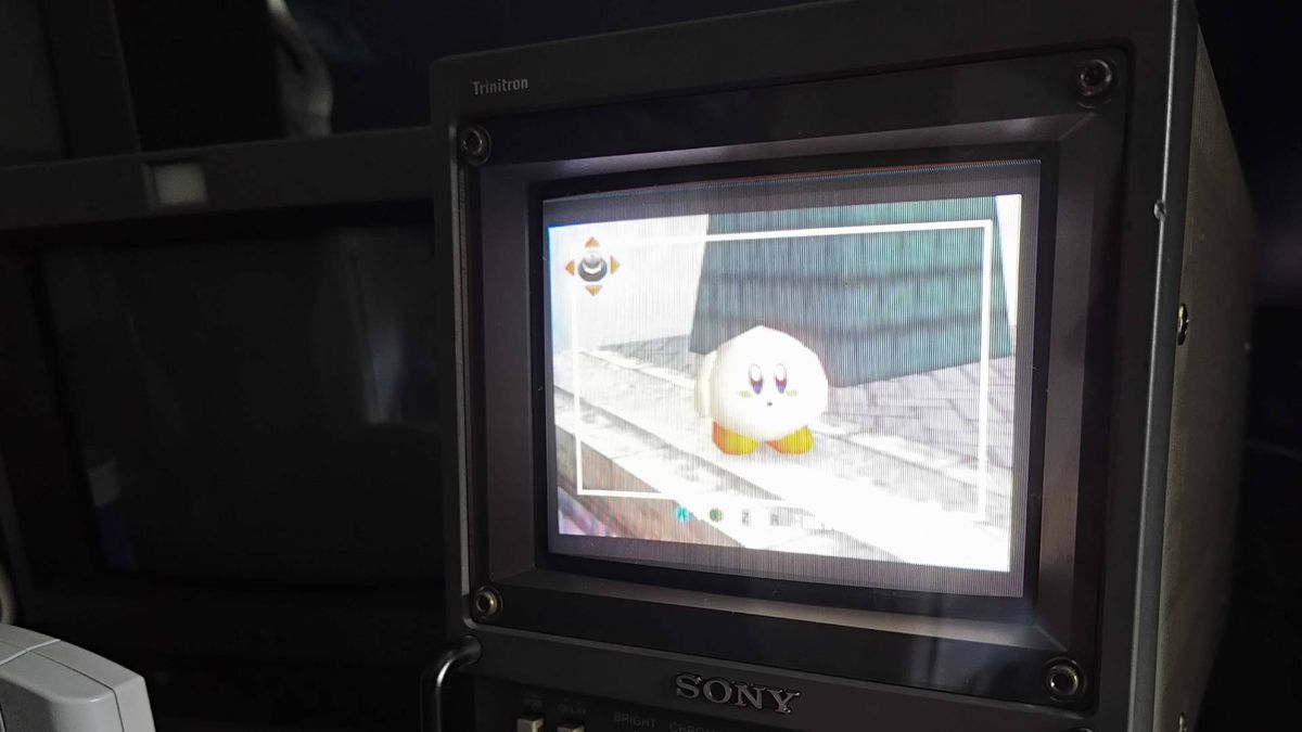 Sony Trinitron PVM CRT with Super Smash Bros gameplay N64 gameplay on screen via poor quality composite cable with overly bright visuals.