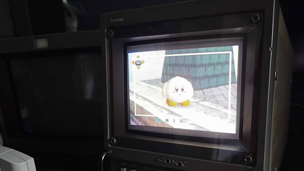 Sony Trinitron PVM CRT with Super Smash Bros gameplay N64 gameplay on screen via poor quality composite cable with overly bright visuals.