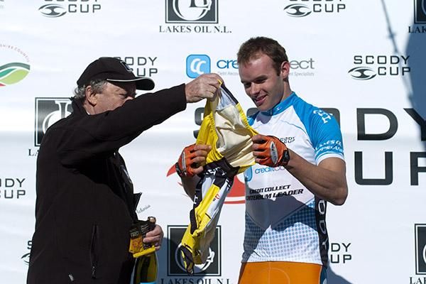 Steele Von Hoff (Genesys Wealth Advisers) from Victoria is presented with his yellow jersey on the podium in Wonthaggi.