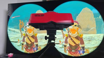 Virtual Boy for Switch sitting in front of TV with Zelda Breath of the Wild on screen and Labo VR stereoscopic 3D feature active.