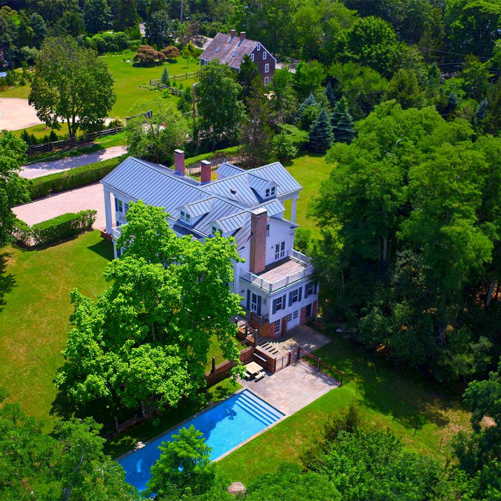 villa with garden lawn and swimming pool