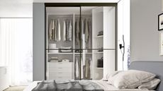 The Cinquanta Scatola wardrobe makes great use of space, combining a walk in design with an exterior shelving unit. 
