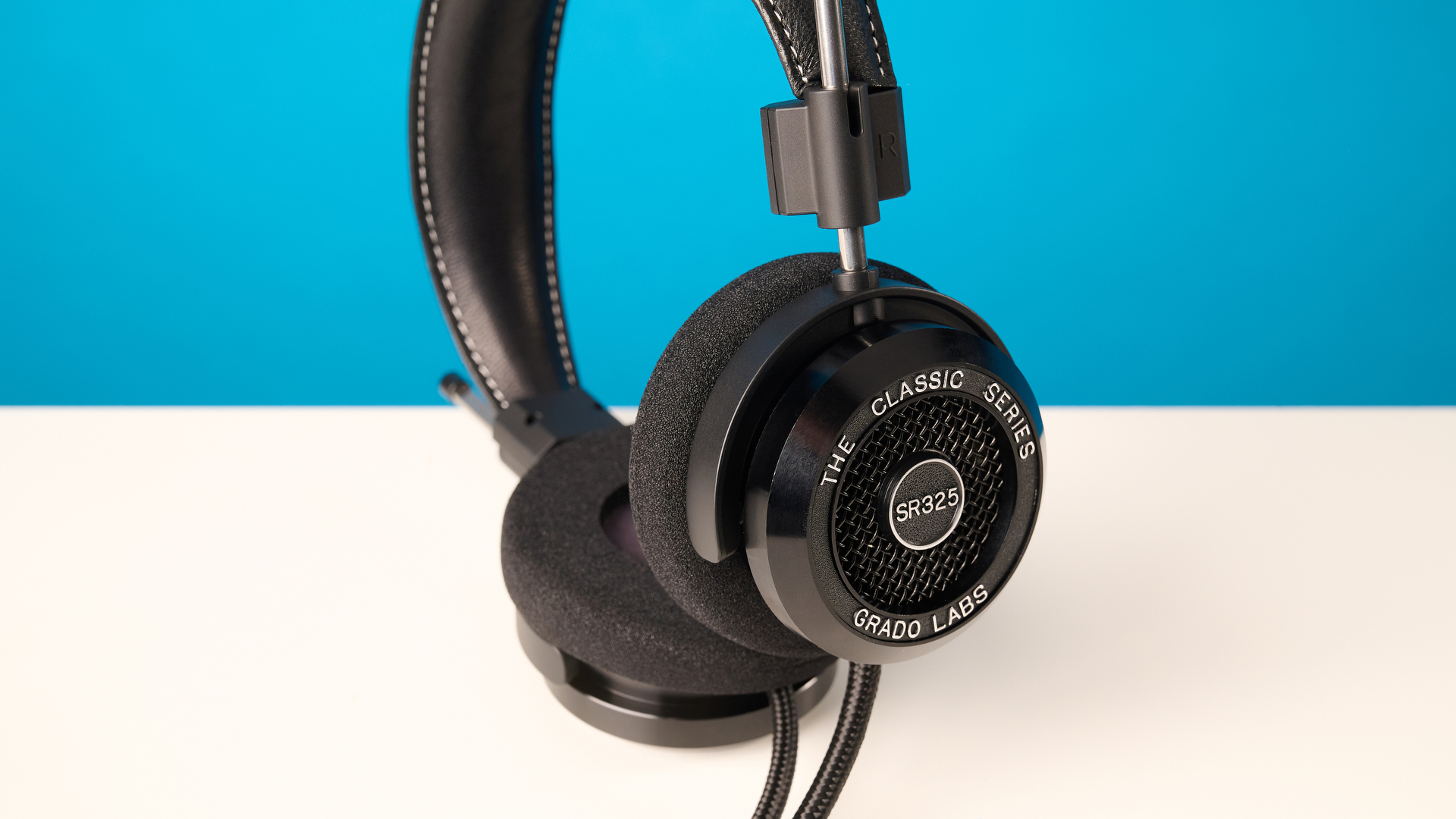 Grado SR325 photographed in front of a blue background