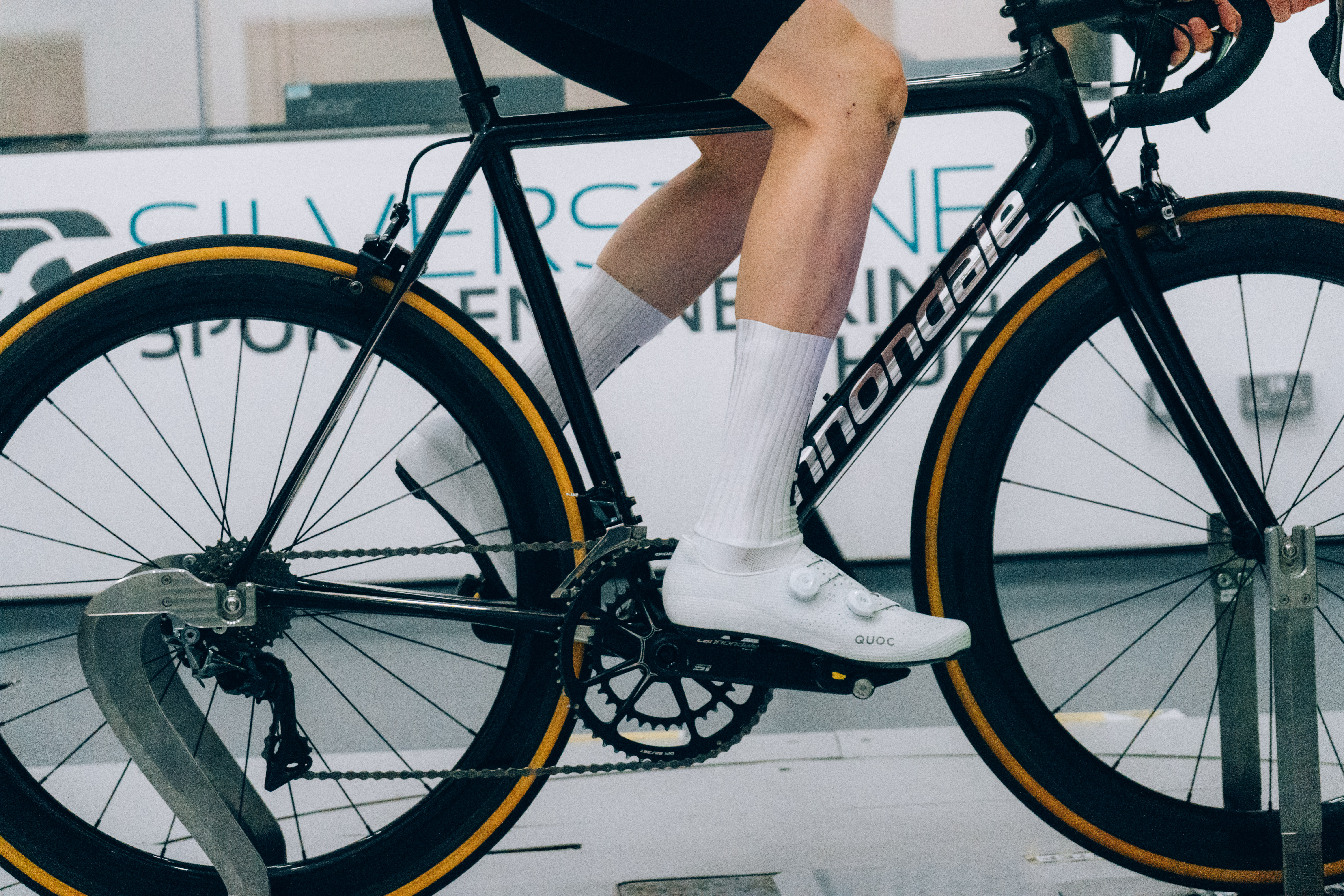 A close up of the socks that Tom is wearing while riding a bike in the wind tunnel