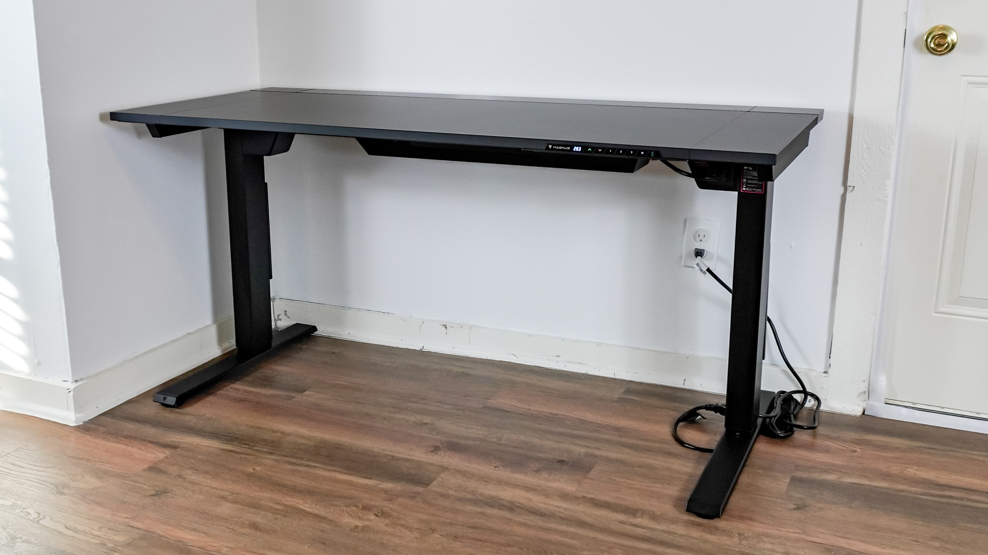 The Secretlab Magnus Evo standing desk up against a wall