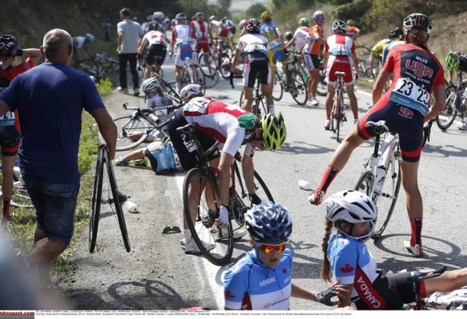 Rider start to pick themselves up and look for their bikes after a big crash