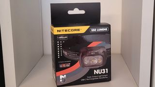 The Nitecore NU31 packaging — a nicely designed black box with a picture of the headlamp and pertinent details on it