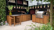 wooden outdoor kitchen with large gas burner