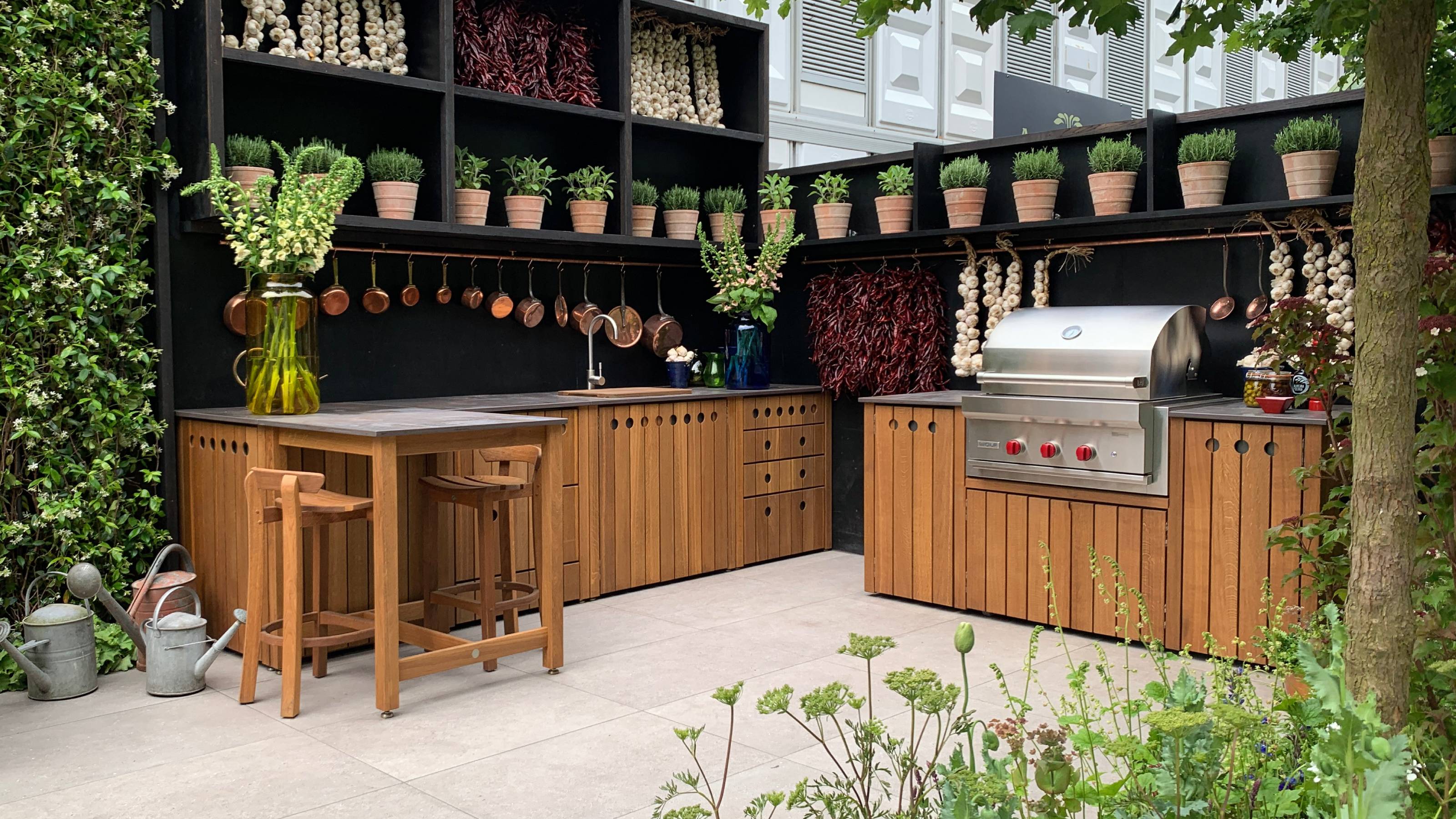 wooden outdoor kitchen with large gas burner