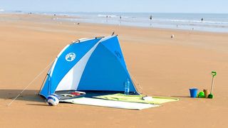 Coleman Weatherproof Sundome Outdoor Shelter on a beach