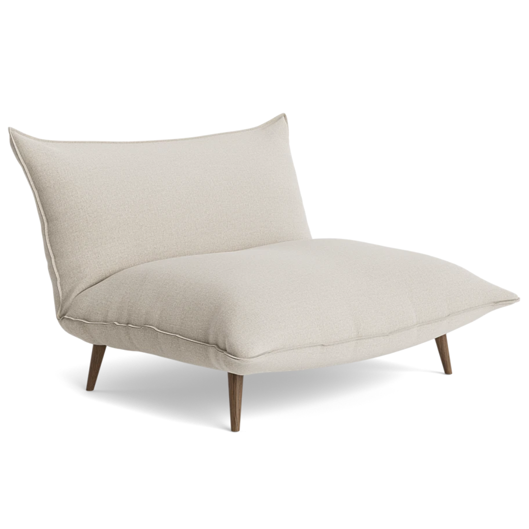 white armchair with no arms and cushions like seats and four dark wood legs