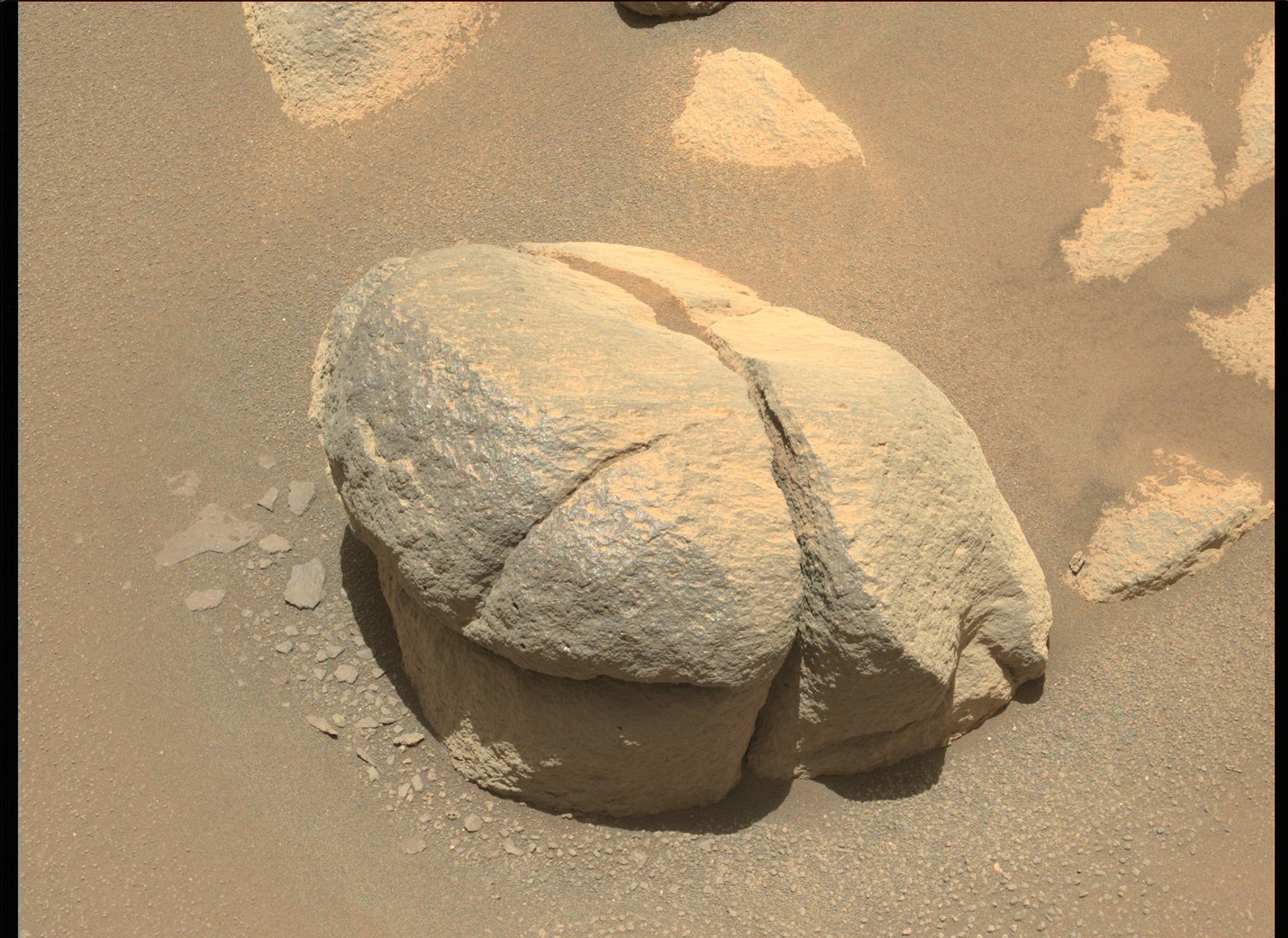 An image of a rock with a crack down the middle