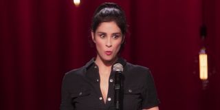 Sarah Silverman speaking to the audience in A Speck of Dust