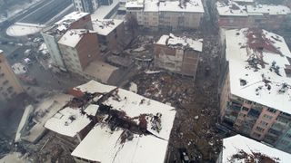 An aerial view of debris of a collapsed building after a 7.7-magnitude earthquake hit Malatya, Turkey on Feb. 6, 2023. 