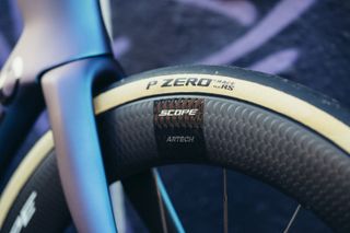 A close up of a deep black bicycle rim with a Pirelli P Zero Race TLR RS tyre mounted to it