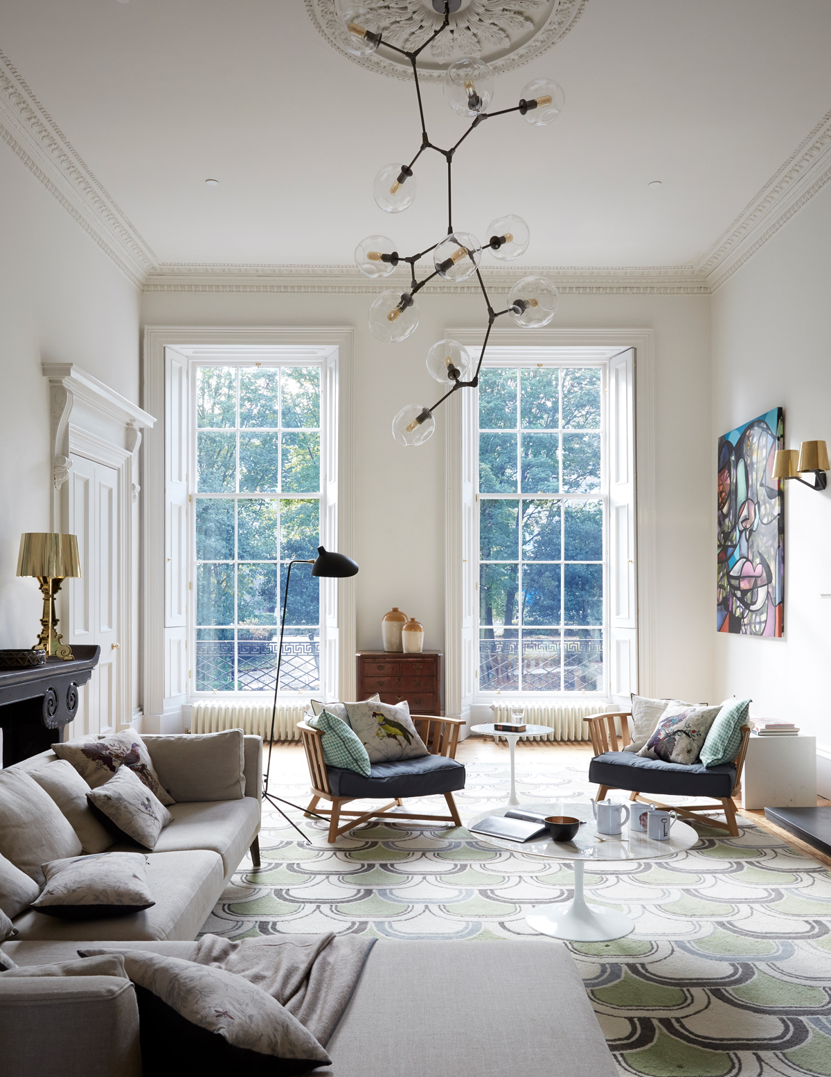 Elegant living room with high ceiling and large windows