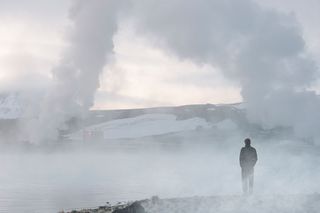 a man standing surrounded by smoke