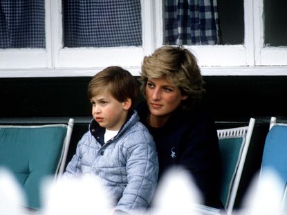 Princess Diana sits with Prince William on her lap