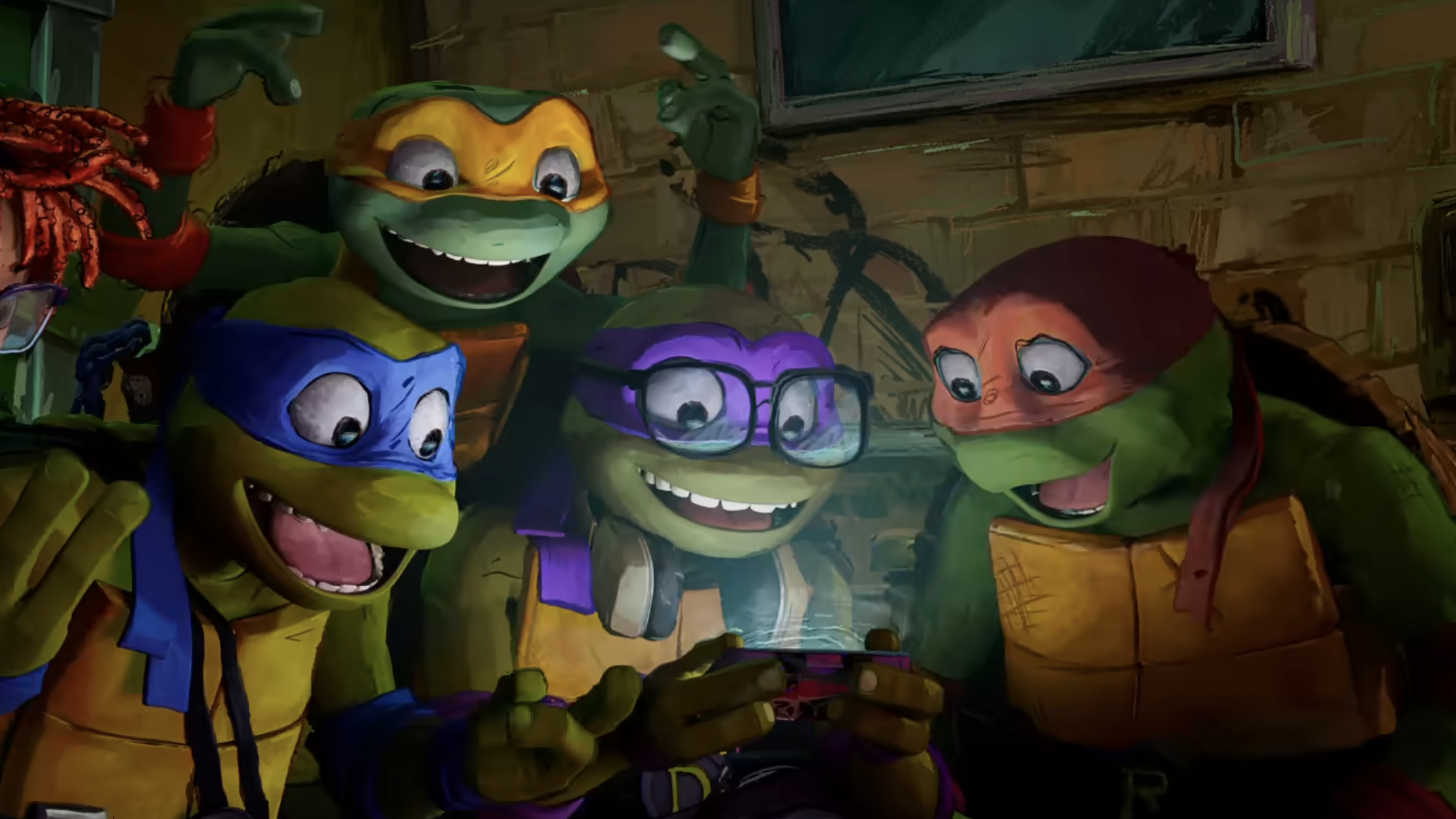 The turtles check out a phone in Teenage Mutant Ninja Turtles: Mutant Mayhem.