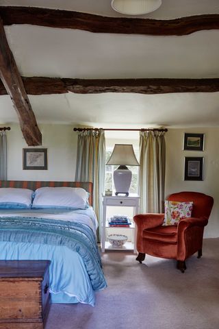 bedroom in a welsh cottage with beamed ceiling