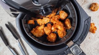 An open air fryer filled with food