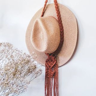 Macrame hat hanger in Terracotta with natural hat