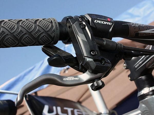 The new Deore brake lever features a radial master cylinder and tool-free reach adjust.