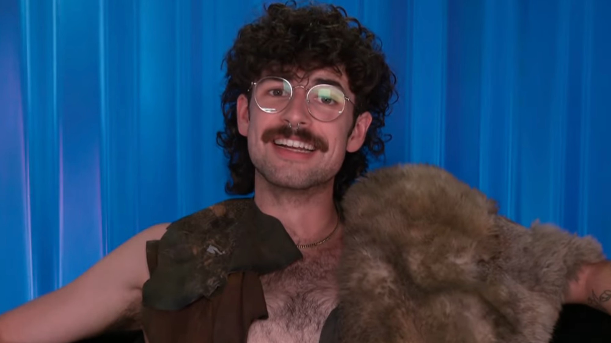 Barrett in a caveman outfit in the diary room