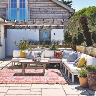 garden with sofa and rug