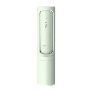 A small portable lint roller in mint green