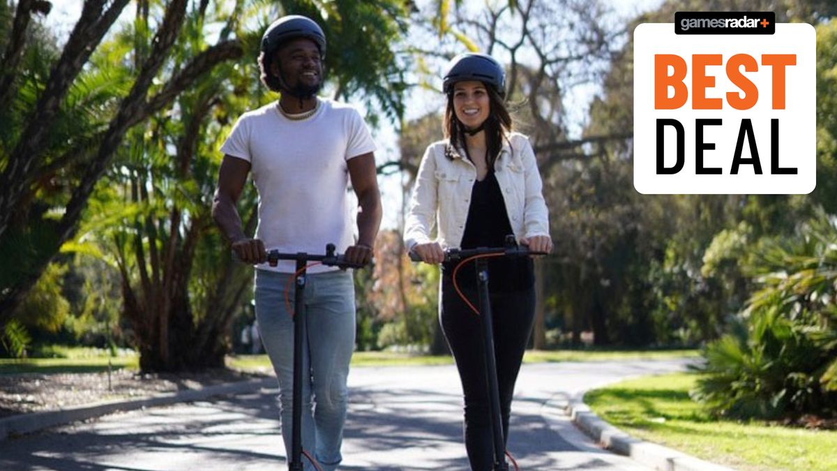 A man and woman riding scooters down a tree-lined road